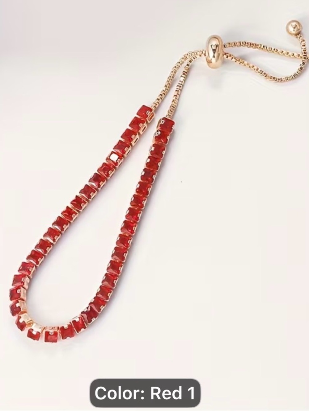 Adjustable Red Tennis Alloy Bracelet with Red Glass Stones.